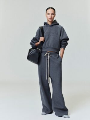 Front, back, and detail views of the authentic Charcoal Heather Essentials hoodie featuring tonal metallic branding, managed by Zizzle LLC.