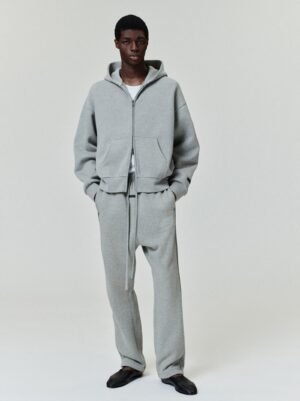 Full lifestyle views of a model wearing the authentic Abbey Stone Essentials full-zip hoodie and matching relaxed joggers, curated by Zizzle LLC.